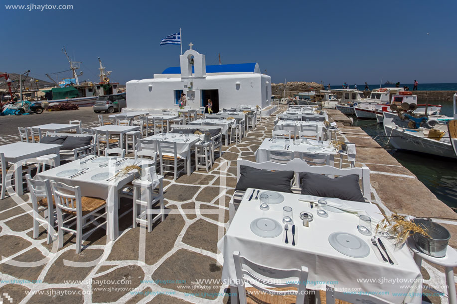 white church and restaurant in Naousa town, Paros island, Cyclades
