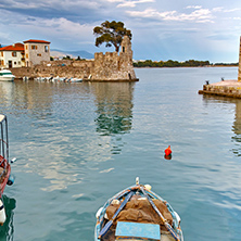 Small boat at Fortification at the port of Nafpaktos town, Western Greece