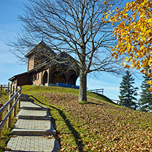 Old church and autumn trees near mount Rigi, Alps, Switzerland