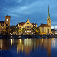 Night panoramic photo of city of Zurich and reflection in Limmat River, Switzerland