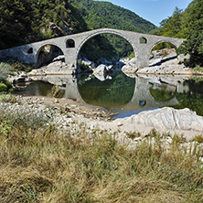 Reflection of Devil"s Bridge in Arda river and Rhodopes mountain, Kardzhali Region, Bulga