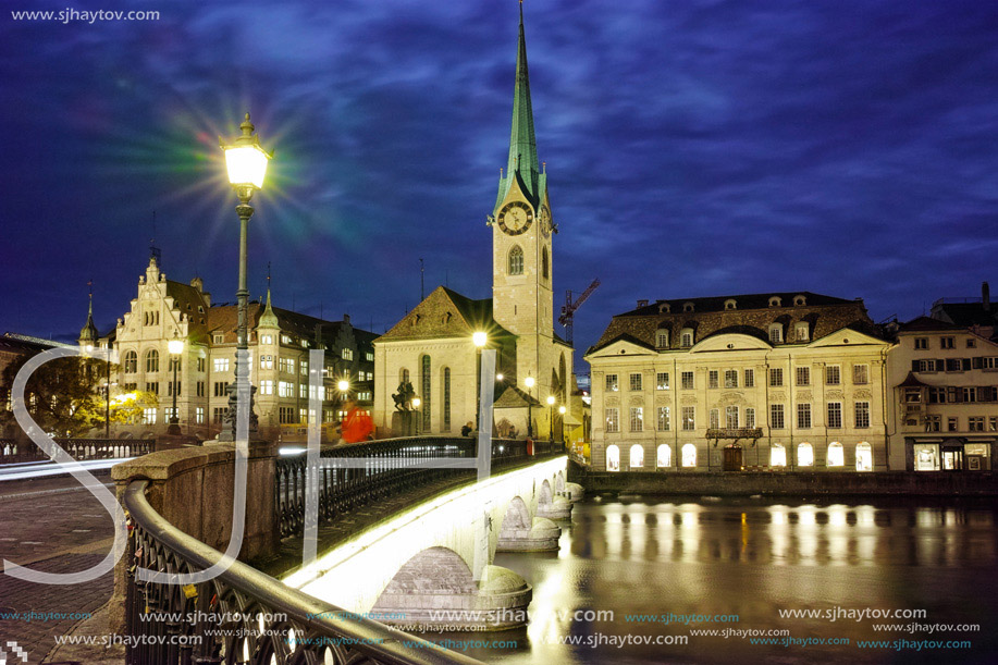 Night panoramic photo of city of Zurich and reflection in Limmat River, Switzerland