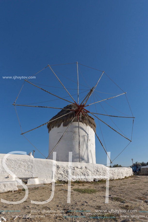 White windmill and medieval wall on the island of Mykonos, Cyclades, Greece