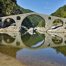 Reflection of The Devil"s Bridge in Arda river and Rhodopes mountain, Kardzhali Region, Bulgaria