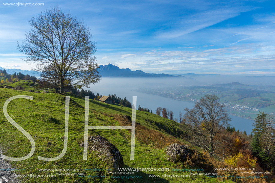 Panoramic view to Mount Pilatus and Lake Lucerne covered with frog, Alps, Switzerland