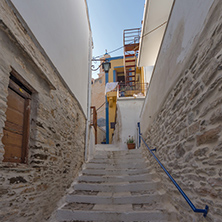 Small street and white houses in old town of Ermopoli, Syros, Cyclades Islands, Greece
