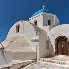 White Orthodox church with blue roof in Santorini island, Thira, Cyclades, Greece