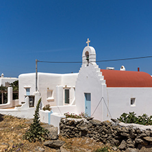 White church with red roof in town of Ano Mera, Mykonos island, Cyclades, Greece