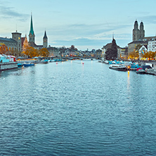 Night photo of city of Zurich and reflection in Limmat River, Switzerland