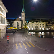 Night photo of Fraumunster Church and bridge over Limmat River, city of Zurich, Switzerland