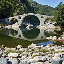 Reflection of Devil Bridge and Rhodopes mountain in Arda river, Kardzhali Region, Bulgaria