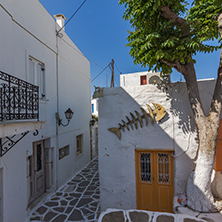 Street with white houses in town of Parakia, Paros island, Cyclades, Greece