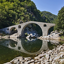 Reflection of Devil"s Bridge and Rhodopes mountain in Arda river, Kardzhali Region, Bulgaria