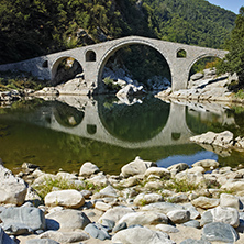 Reflection of The Devil"s Bridge in Arda river and Rhodopes mountain, Kardzhali Region, Bulgaria