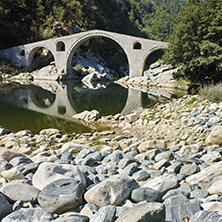 Reflection of The Devil"s Bridge and Rhodopes mountain in Arda river, Kardzhali Region, Bulgaria