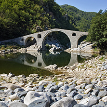 Reflection of The Devil"s Bridge and Rhodopes mountain in Arda river, Kardzhali Region, Bulgaria