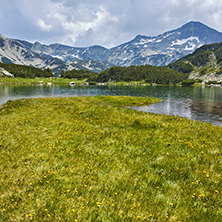 Amazing panorama of Banderishki chukar peak and Reflection in Muratovo lake, Pirin Mountain, Bulgaria
