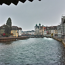 City of Luzern and reflection of old town in The Reuss River, Switzerland