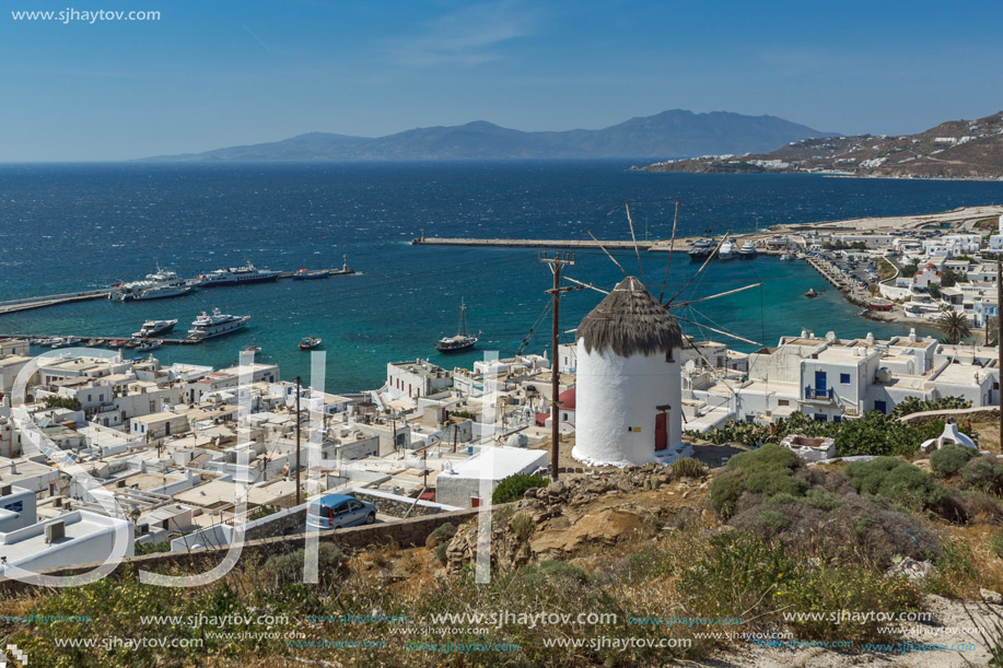 Amazing Seascape of white windmill and Panorama to island of Mykonos, Cyclades, Greece