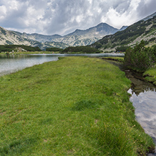 Panoramic view of Banderishki chukar peak and green meadows around Muratovo lake, Pirin Mountain, Bulgaria