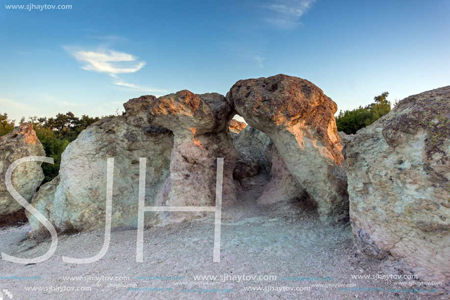 The first rays of the sun over  The Stone Mushrooms near Beli plast village, Kardzhali Region, Bulgaria