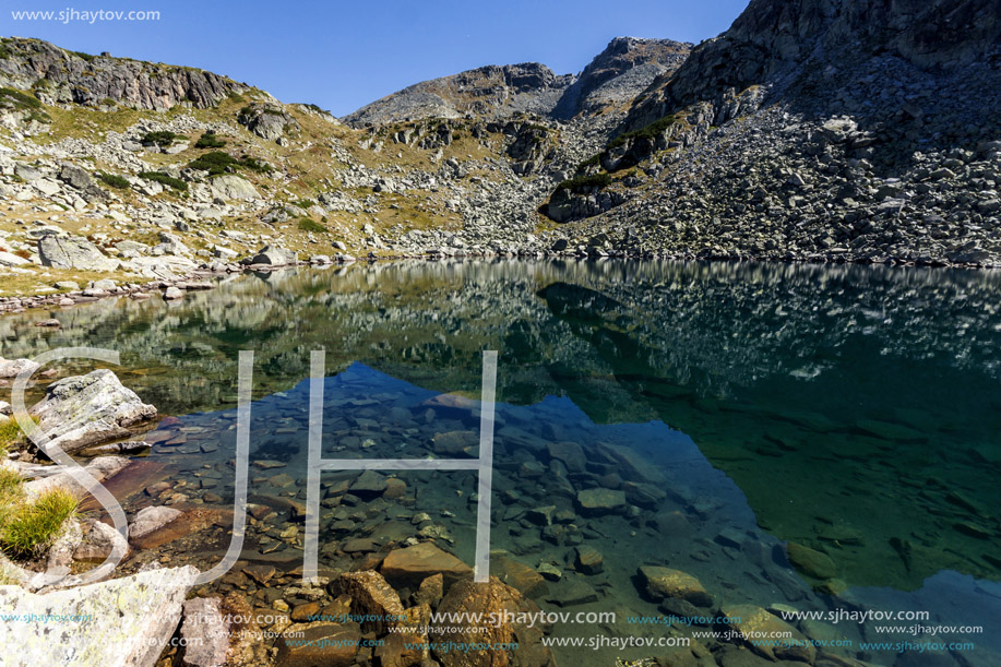 Amazing Panorama of Lake and reflection of Preokorets (Popova Kapa) peak, Rila Mountain, Bulgaria