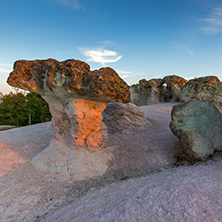 The first rays of the sun over  The Stone Mushrooms near Beli plast village, Kardzhali Region, Bulgaria