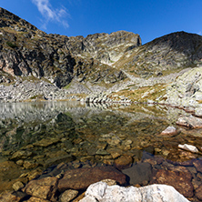 Stones in the water of Elenski lakes and Malyovitsa peak, Rila Mountain, Bulgaria
