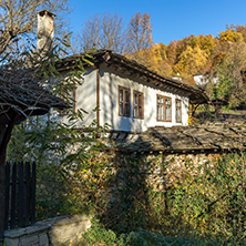 Old houses and Autumn hills in  village of Bozhentsi, Gabrovo region, Bulgaria