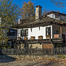 Old house with wooden fence in  village of Bozhentsi, Gabrovo region, Bulgaria