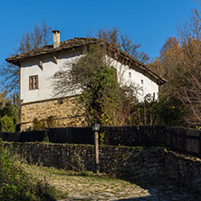 Cobblestone street and old house in village of Bozhentsi, Gabrovo region, Bulgaria