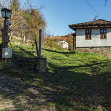 Panorama with Cobblestone street and old house in village of Bozhentsi, Gabrovo region, Bulgaria