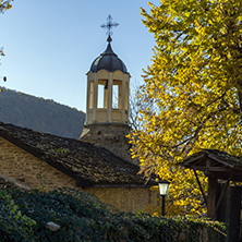 Amazing view Autumn trees and Church of Saint Prophet Elijah in village of Bozhentsi, Gabrovo region, Bulgaria