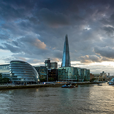 LONDON, ENGLAND - JUNE 15 2016: Sunset photo of The Shard skyscraper and City Hall from Thames river, England, Great Britain