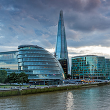 LONDON, ENGLAND - JUNE 15 2016: Amazing Sunset photo of The Shard skyscraper and City Hall from Thames river, England, Great Britain