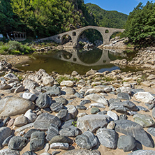 Reflection of The Devil"s Bridge and Rhodopes mountain in Arda river, Kardzhali Region, Bulgaria