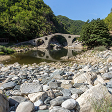 Reflection of The Devil"s Bridge and Rhodopes mountain in Arda river, Kardzhali Region, Bulgaria