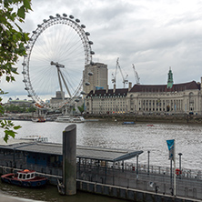 LONDON, ENGLAND - JUNE 16 2016: The London Eye and County Hall, Westminster, London, England, Great Britain