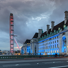 LONDON, ENGLAND - JUNE 16 2016: Night photo of The London Eye and County Hall from Westminster bridge, London, England, Great Britain