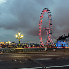 LONDON, ENGLAND - JUNE 16 2016: Night photo of The London Eye and County Hall from Westminster bridge, London, England, Great Britain