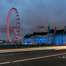 LONDON, ENGLAND - JUNE 16 2016: Night photo of The London Eye and County Hall from Westminster bridge, London, England, Great Britain