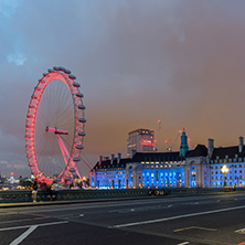 LONDON, ENGLAND - JUNE 16 2016: Night photo of The London Eye and County Hall from Westminster bridge, London, England, Great Britain