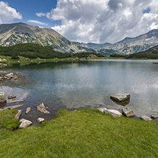 Landscape of Banderishki Chukar and Todorka Peaks and reflection in Muratovo lake, Pirin Mountain, Bulgaria
