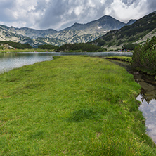 Landscape of Banderishki Chukar Peak and reflection in Muratovo lake, Pirin Mountain, Bulgaria