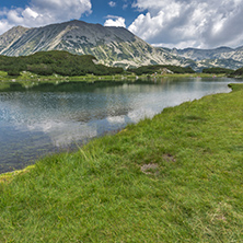 Landscape of Todorka Peak and reflection in Muratovo lake, Pirin Mountain, Bulgaria