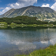 Amazing Panorama with Todorka Peak and reflection in Muratovo lake, Pirin Mountain, Bulgaria