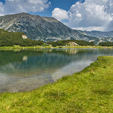 Landscape of Todorka Peak and reflection in Muratovo lake, Pirin Mountain, Bulgaria