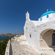 Amazing seascape with White chuch with blue roof in town of Parakia, Paros island, Cyclades, Greece