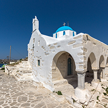 White chuch with blue roof in town of Parakia, Paros island, Cyclades, Greece