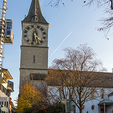 ZURICH, SWITZERLAND - 28 OCTOBER 2015 : St. Peter Church and autumn trees, City of Zurich, Switzerland